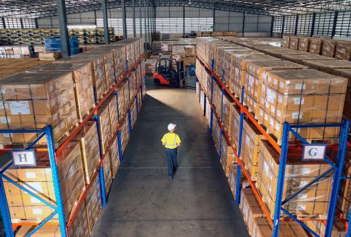 Aerial view of warehouse workers Working and Walking in The Distribution Warehouse